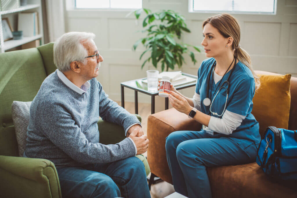 weekend doctor talking to her patient at his house