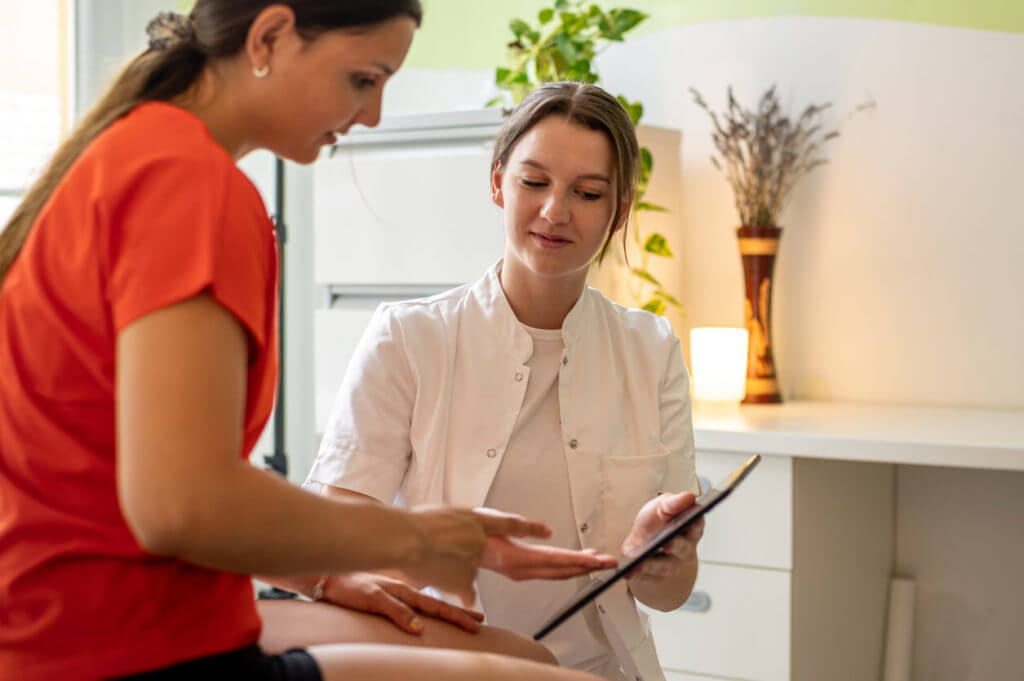 internal medicine doctor talking to her patient